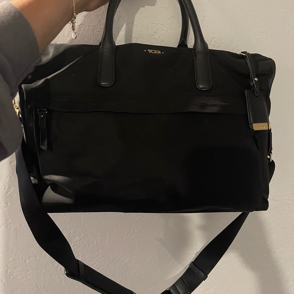 Tumi Black nylon travel bag with Gold Accent